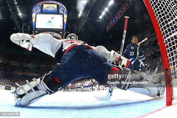 Dustin Byfuglien of the Winnipeg Jets competes against Cory Schneider of the New Jersey Devils in the Discover NHL Shootout during the 2016 Honda NHL...