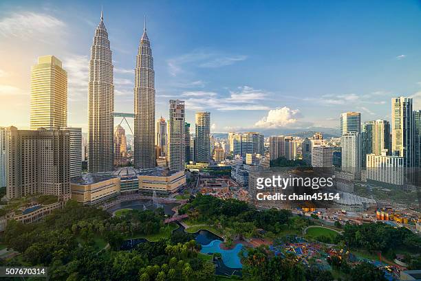 twin tower in malaysia, asian during twilight - kuala lumpur stock pictures, royalty-free photos & images