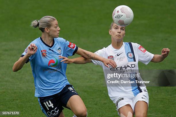 Alanna Kennedy of Sydney FC and Steph Catley of Melbourne City compete for the ball during the 2016 W-League Grand Final match between Melbourne...