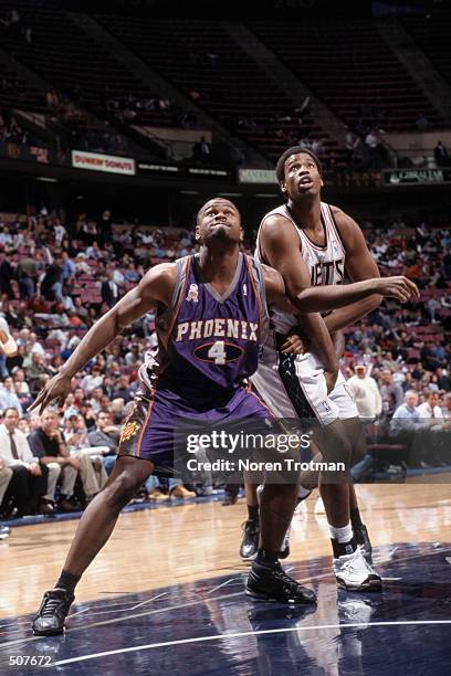 Forward Alton Ford of the Phoenix Suns boxes out forward Jason Collins of the New Jersey Nets during the NBA game at Continental Airlines Arena in...