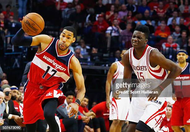 Garrett Temple of the Washington Wizards drives with the basketball in front of Clint Capela of the Houston Rockets during their game at the Toyota...