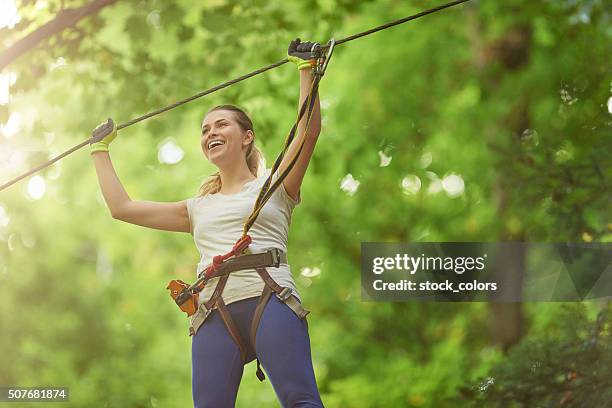 leisure time in adventure park - zip line stock pictures, royalty-free photos & images