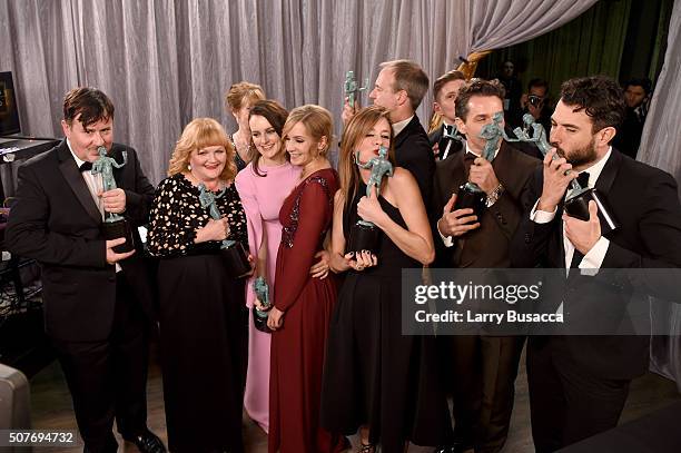 Actors Jeremy Swift, Leslie Nicol, Sophie McShera, Joanne Froggatt, Raquel Cassidy, Kevin Doyle, Allen Leech, and Tom Cullen pose backstage at the...