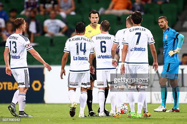 Referee Kris Griffiths-Jones talks with Victory players before issueing Fahid Ben Khalfallah of the Victory a red card during the round 17 A-League...