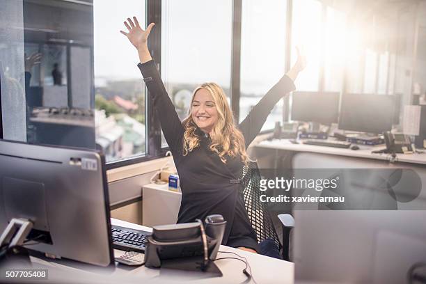 happy with work at the office - office cheering stock pictures, royalty-free photos & images