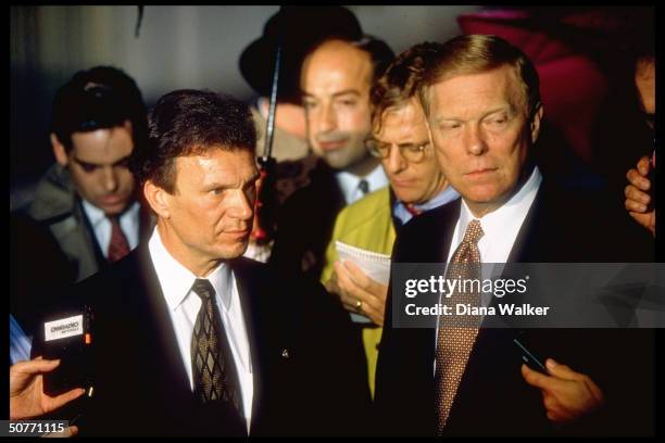 Democratic congressional leaders Sen. Tom Daschle & Rep. Dick Gephardt speaking to press on rainy White House driveway after mtg. W. Pres. Clinton.