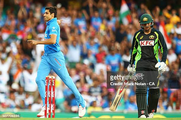 Ashish Nehra of India celebrates the wicket of Usman Khawaja during the International Twenty20 match between Australia and India at Sydney Cricket...