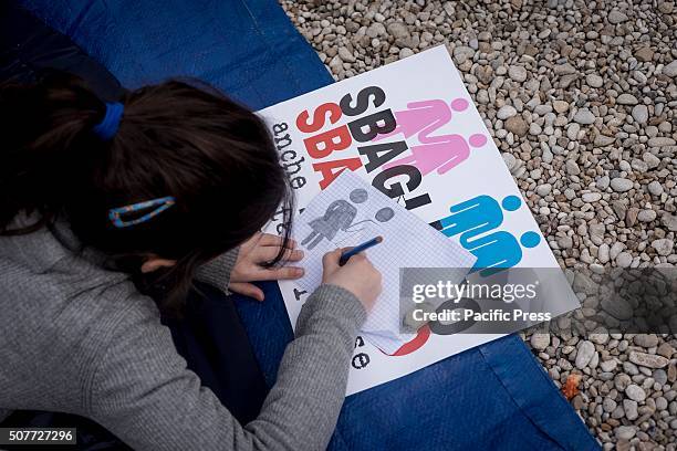 Girl draws during demonstration in Rome. "Family Day", an event organized in defense of traditional Catholic family values and opposed to the...