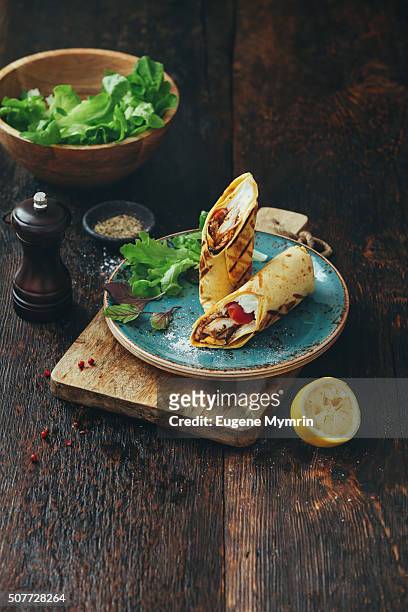 wrap sandwich with chicken and vegetables - mexican food plate stock pictures, royalty-free photos & images
