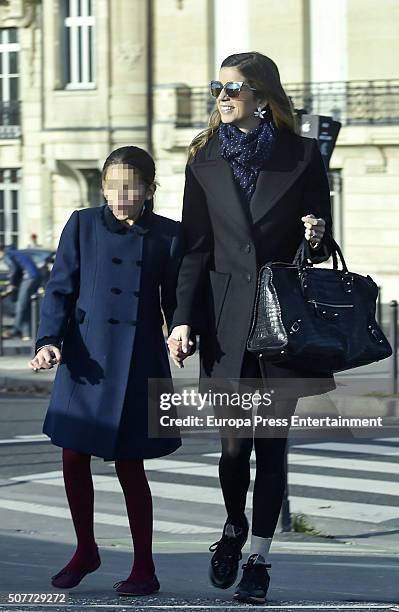 Part of this image has been pixellated to obscure the identity of the child) Margarita Vargas and her daughter Eugenia de Borbon are seen going for...