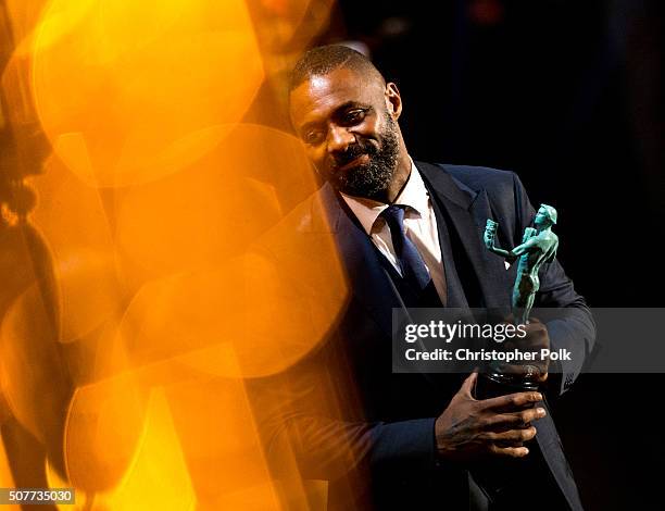 Idris Elba receives the award for Outstanding Performance by a Male Actor in a Supporting Role for 'Beasts of No Nation' onstage during The 22nd...