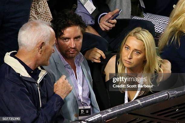 Vincent Fantauzzo and Asher Keddie watch the Men's Singles Final match between Andy Murray of Great Britain and Novak Djokovic of Serbia during day...