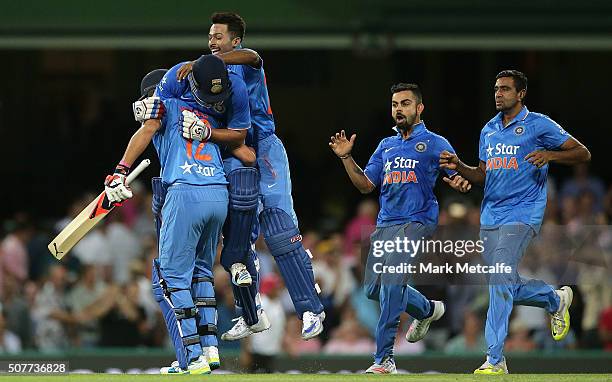 Suresh Raina of India and Yuvraj Singh of India celebrate victory with team mates in the International Twenty20 match between Australia and India at...