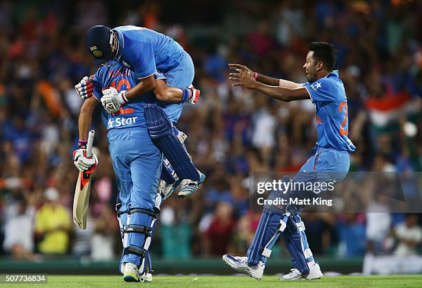 Suresh Raina of India celebrates hitting the winning runs on the last ball of the match with Yuvraj Singh of India during the International Twenty20...