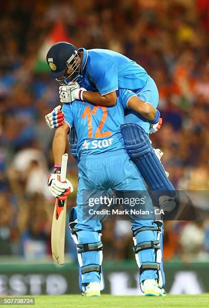 Yuvraj Singh and Suresh Raina of India celebrate winning the International Twenty20 match between Australia and India at Sydney Cricket Ground on...