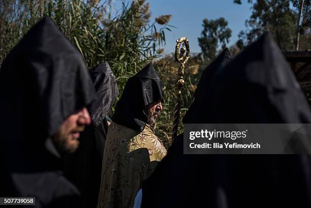 Patriarch of Armenian church of Jerusalem Nourhan Manougian seen praying at the baptism site for the Epiphany ceremony on January 31, 2016 in Qasr al...