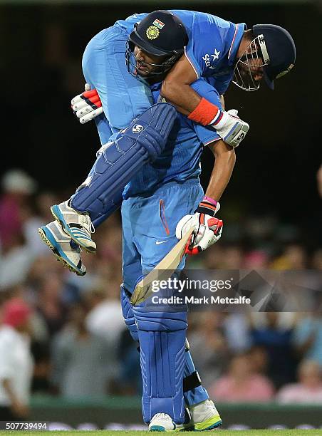 Suresh Raina of India and Yuvraj Singh of India celebrate victory in the International Twenty20 match between Australia and India at Sydney Cricket...