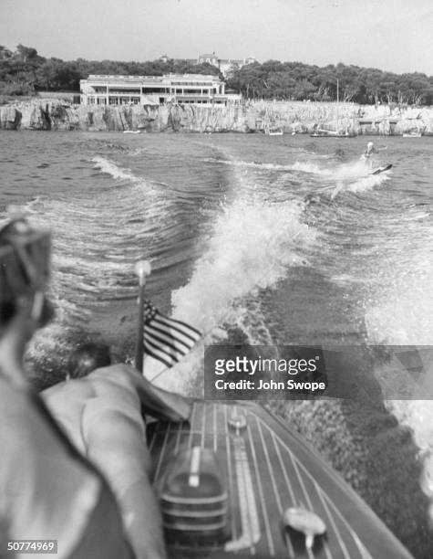 Water skiing enthusiast Sonja Heine takes turn behind a peedboat in front of Eden Roc.