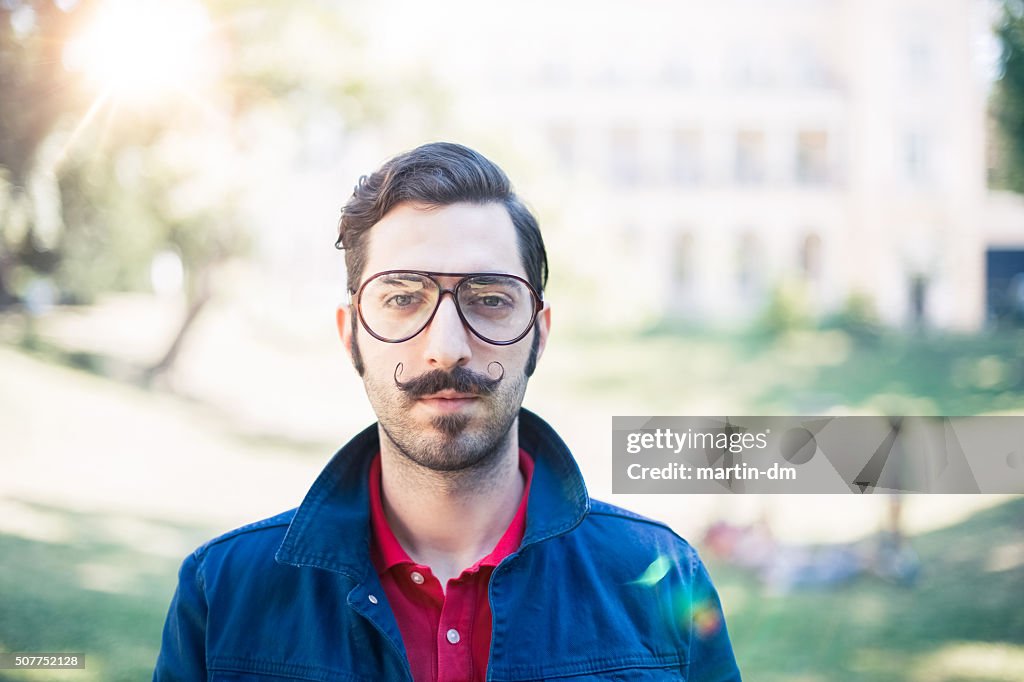 Retro styled man looking at camera