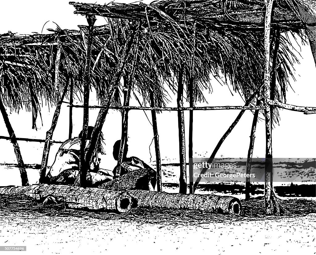 Paar unter Palapa am Strand