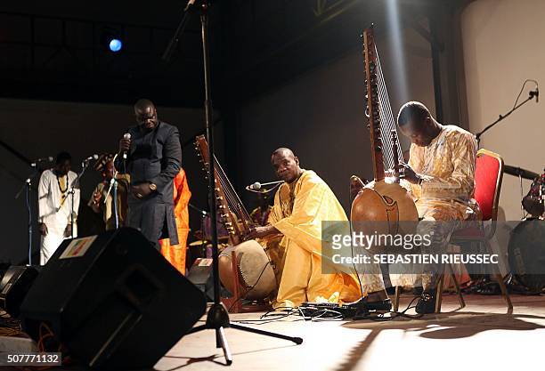 Picture taken on January 27, 2016 shows Malian kora players Toumani and Sidiki Diabaté during the Bamako Acoustik Festival in Bamako. The Bamako...