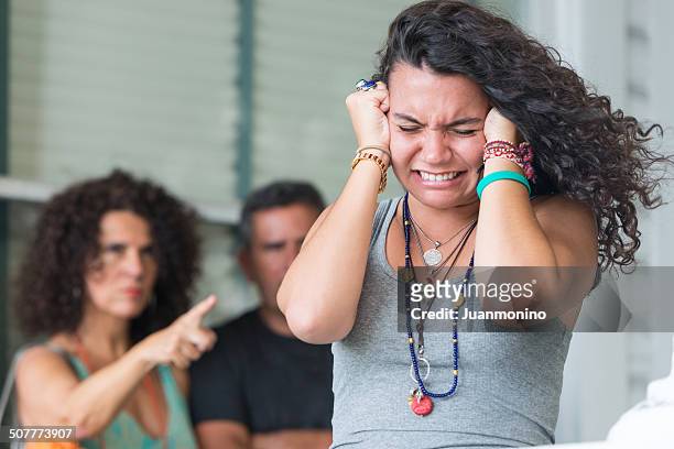 stressed daughter - parents arguing stock pictures, royalty-free photos & images