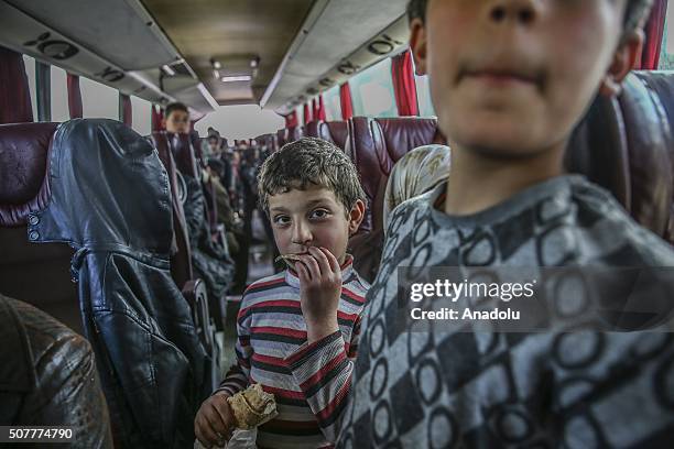 Turkmen families, fled from their homes due to Russian and Assad Regime forces attacks to Turkmen villages in Lattakia, arrive Yayladagi YIBO camp in...