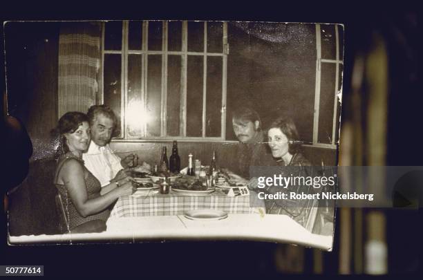 German Nazi doctor and war criminal Josef Mengele eats with an unidentified woman and man and maid Elza Gulpian de Oliveira, Brazil, 1970s.