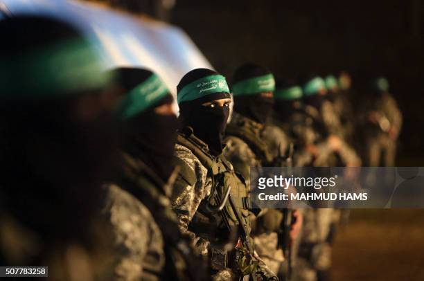 Palestinian members of the Ezzedine al-Qassam Brigades, the armed wing of the Hamas movement, take part in a gathering on January 31, 2016 in Gaza...