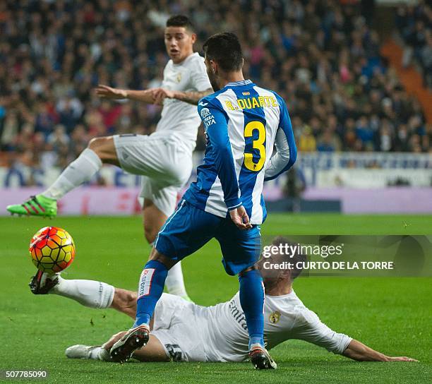 Espanyol's defender Ruben Duarte vies with Real Madrid's defender Dani Carvajal during the Spanish league football match Real Madrid CF vs RCD...