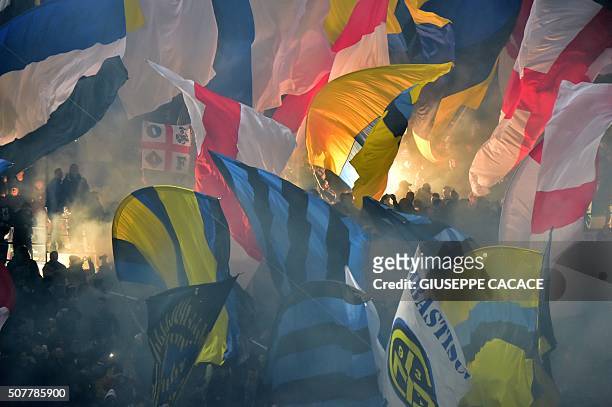 Inter Milan's supporters wave flags during the Italian Serie A football match between AC Milan and Inter Milan at San Siro Stadium in Milan on...