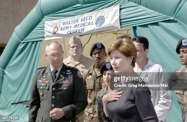 First Lady Laura Bush speaking to the press after visiting with patients who were victims of the Pentagon terrorist attack at Walter Reed Army...