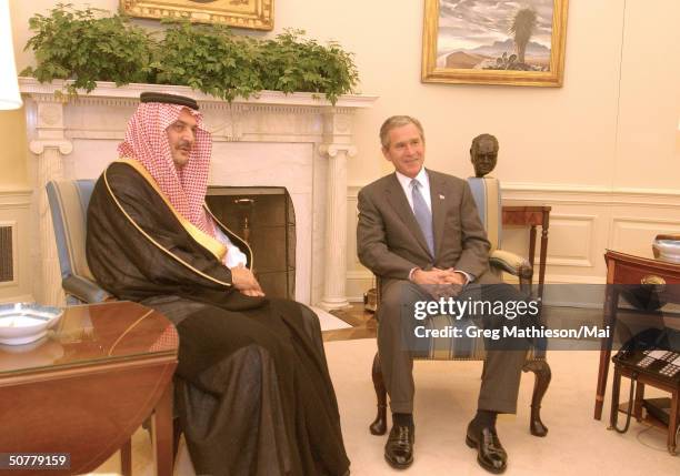 President Bush meeting with Foreign Minister of Saudi Arabia Saud Al-Faisal in the Oval Office.