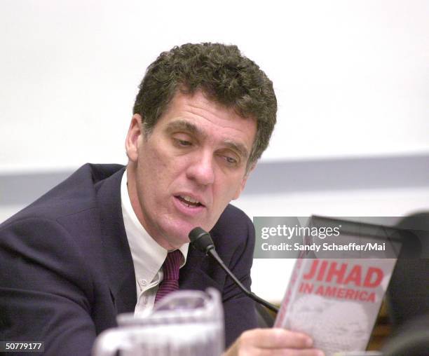 Congressman Dave Weldon holding video tape entitled Jihad in America during hearing of Committee on Government Reform.