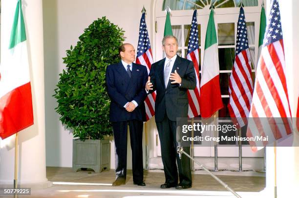 Visiting Italian Prime Minister Silvio Berlusconi and President Bush answering reporters questions during press conference in the Rose Garden.