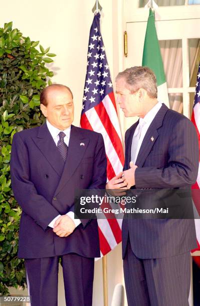 Visiting Italian Prime Minister Silvio Berlusconi and President Bush in the Rose Garden of the White House.