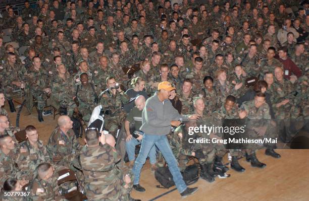 Neal McCoy singing for US military troops stationed at Eagle Base in Tusla, Bosnia as part of the USO 2001 Holiday Tour.