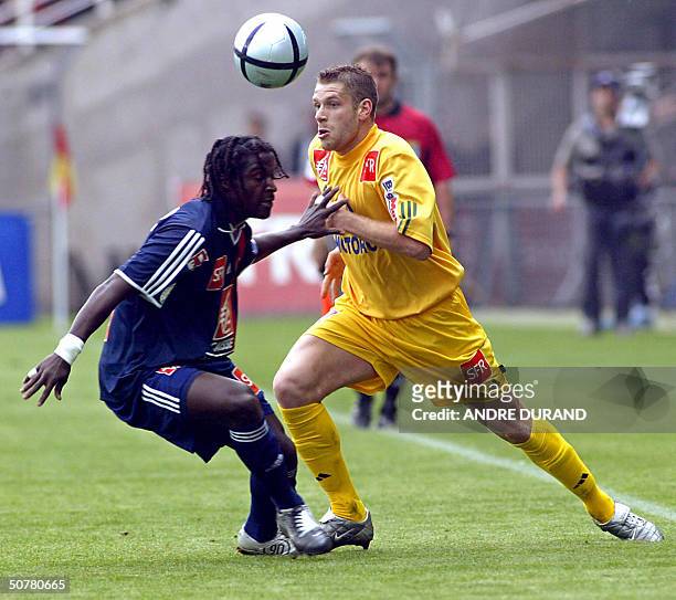 Paris Saint-Germain's defender Bernard Mendy vies with Nantes's defender Sylvain Armand , during their French Cup semi final soccer match, 28 April...