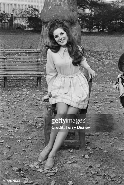 American singer-songwriter Bobbie Gentry poses on a park bench, 13th October 1969.