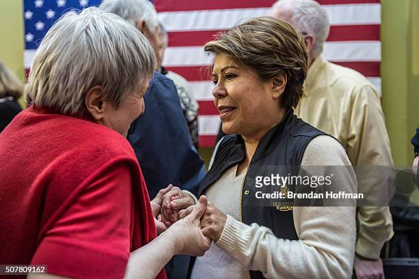 Joni Sotter of Marion, Iowa, greets Columba Bush , wife of Republican presidential candidate Jeb Bush, following a campaign event at his local field...