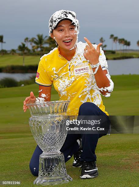 Hyo Joo Kim of South Korea reacts after being sprayed with Pure Silk shave cream after winning the Pure Silk Bahamas LPGA Classic at the Ocean Club...