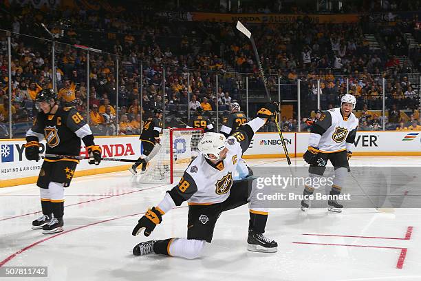John Scott of the Arizona Coyotes celebrates after scoring a goal in the first period of the Western Conference Semifinal Game between the Central...