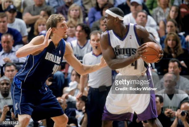 Chris Webber of the Sacramento Kings looks to drive on Dirk Nowitzki of the Dallas Mavericks during game two of the first round of the 2004 Western...