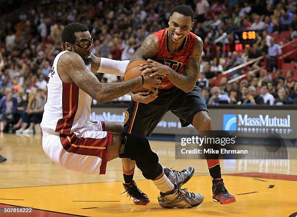 Amar'e Stoudemire of the Miami Heat and Jeff Teague of the Atlanta Hawks fight for a ball during a game at American Airlines Arena on January 31,...