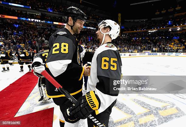 John Scott of the Arizona Coyotes shakes hands with Erik Karlsson of the Ottawa Senators after the 2016 Honda NHL All-Star Final Game between the...