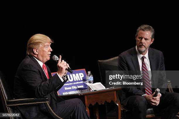 Donald Trump, president and chief executive of Trump Organization Inc. And 2016 Republican presidential candidate, left, speaks as Jerry Falwell Jr.,...