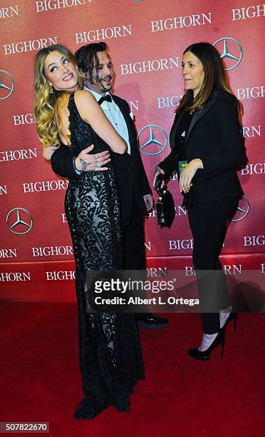Actress Amber Heard and actor Johnny Depp with publicist Robyn Baum arrive for the 27th Annual Palm Springs International Film Festival Awards Gala...