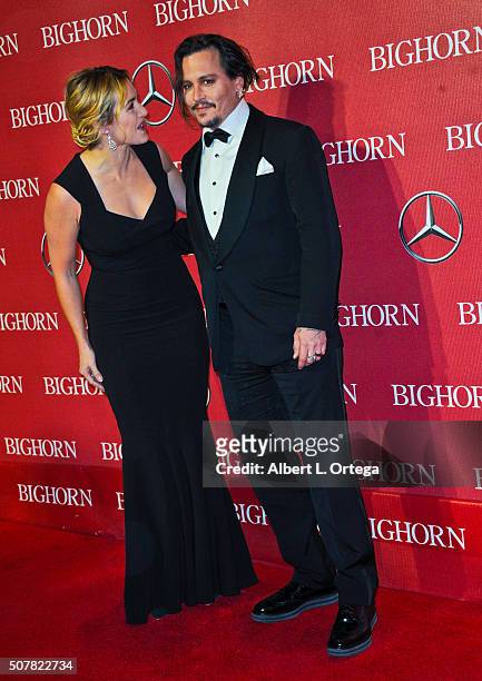 Actress Kate Winslet and actor Johnny Depp arrive for the 27th Annual Palm Springs International Film Festival Awards Gala held at Palm Springs...