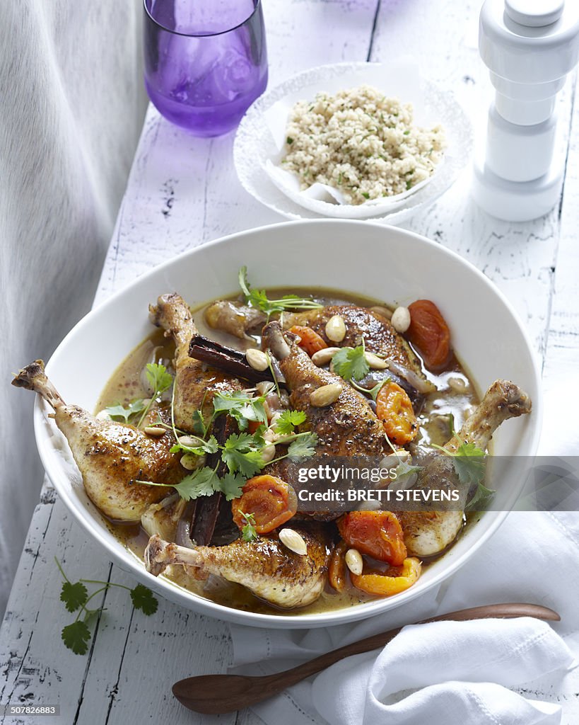 Bowl of chicken tagine with apricots and almonds