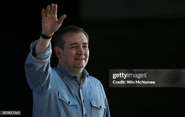 Republican presidential candidate Sen. Ted Cruz waves to Iowa voters while arriving on stage at the Iowa State Fairgrounds January 31, 2016 in Des...